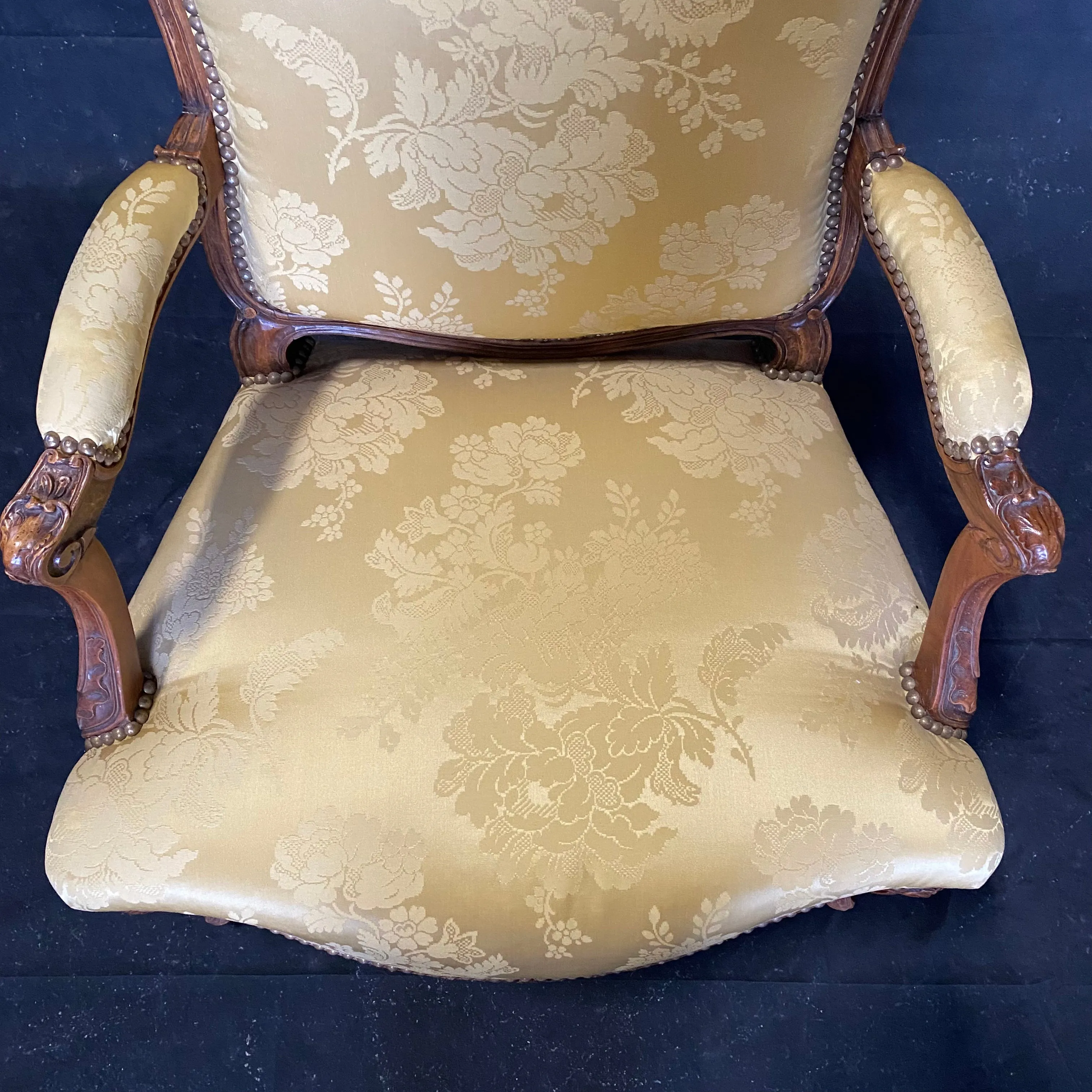 Pair of French Louis XV Walnut Carved Fauteuils or Arm Chairs with Pale Flaxen Yellow Damask and Brass Tacking