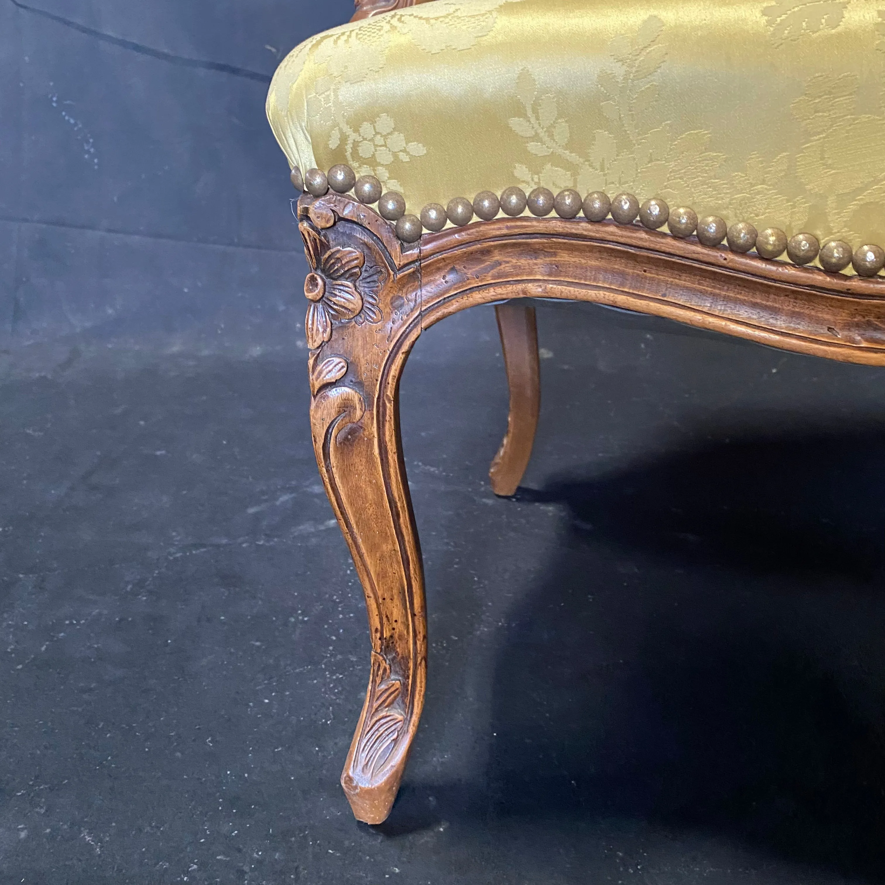 Pair of French Louis XV Walnut Carved Fauteuils or Arm Chairs with Pale Flaxen Yellow Damask and Brass Tacking