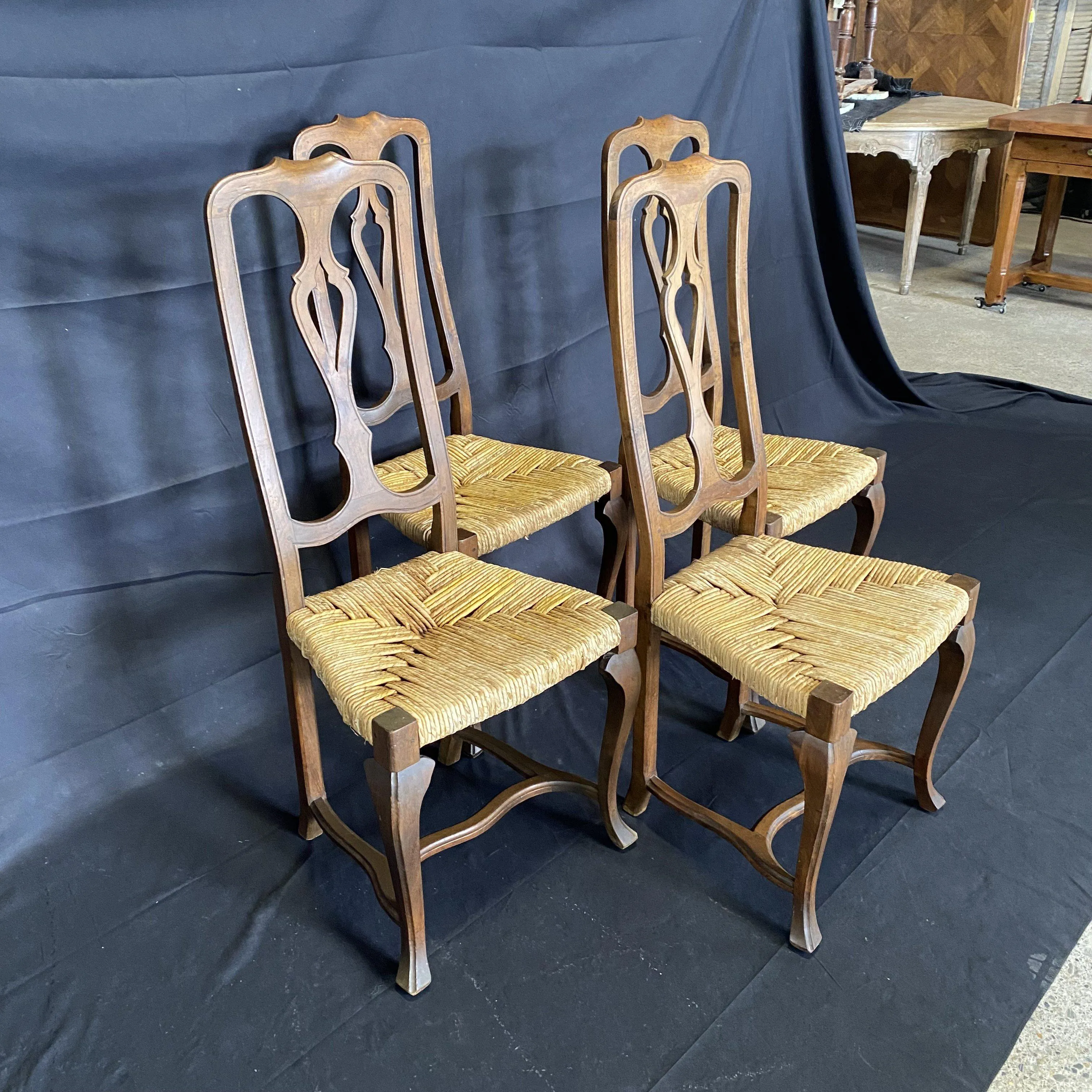 Set of Four 19th Century Country French Provincial Walnut Dining Chairs with Patterned Rush Seats