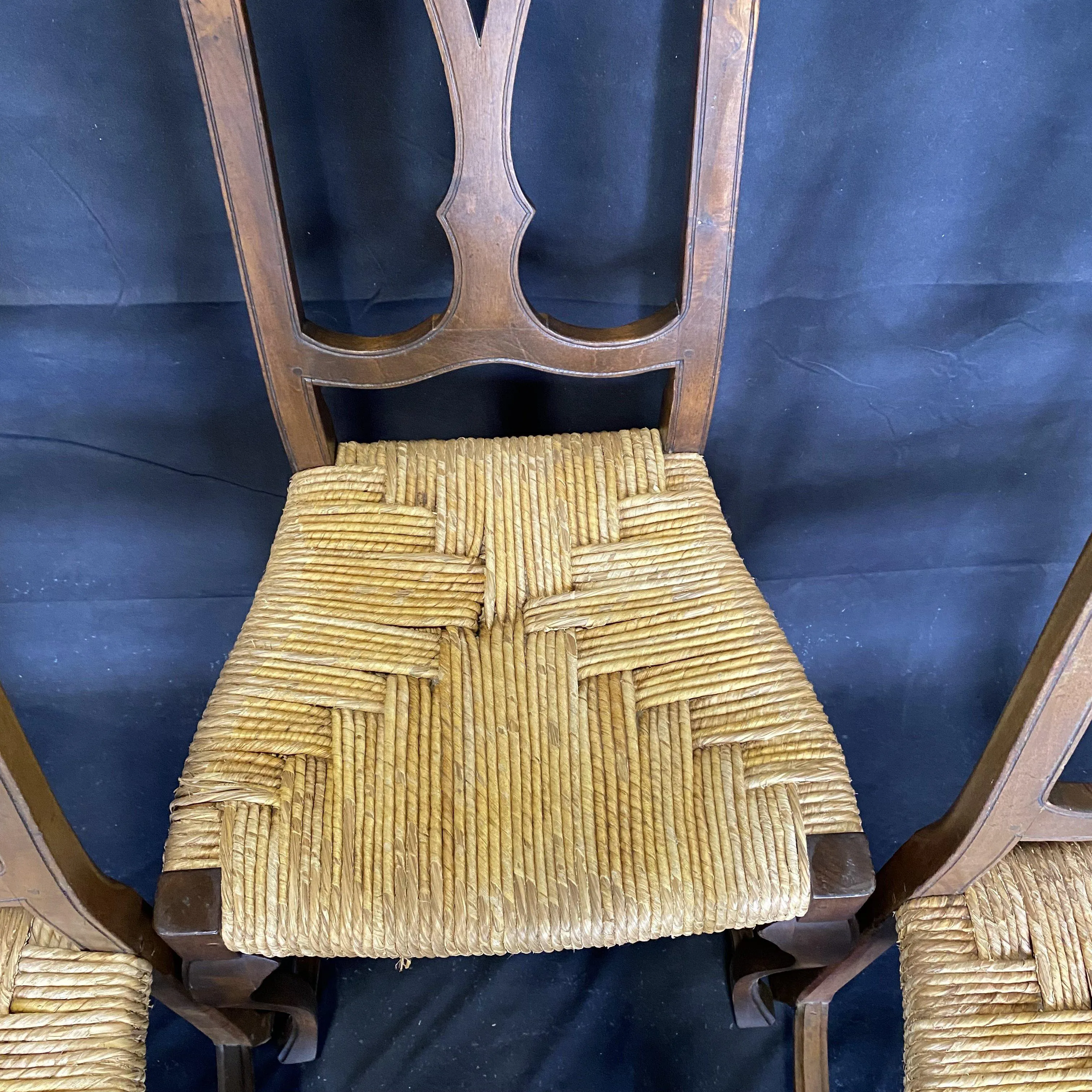 Set of Four 19th Century Country French Provincial Walnut Dining Chairs with Patterned Rush Seats