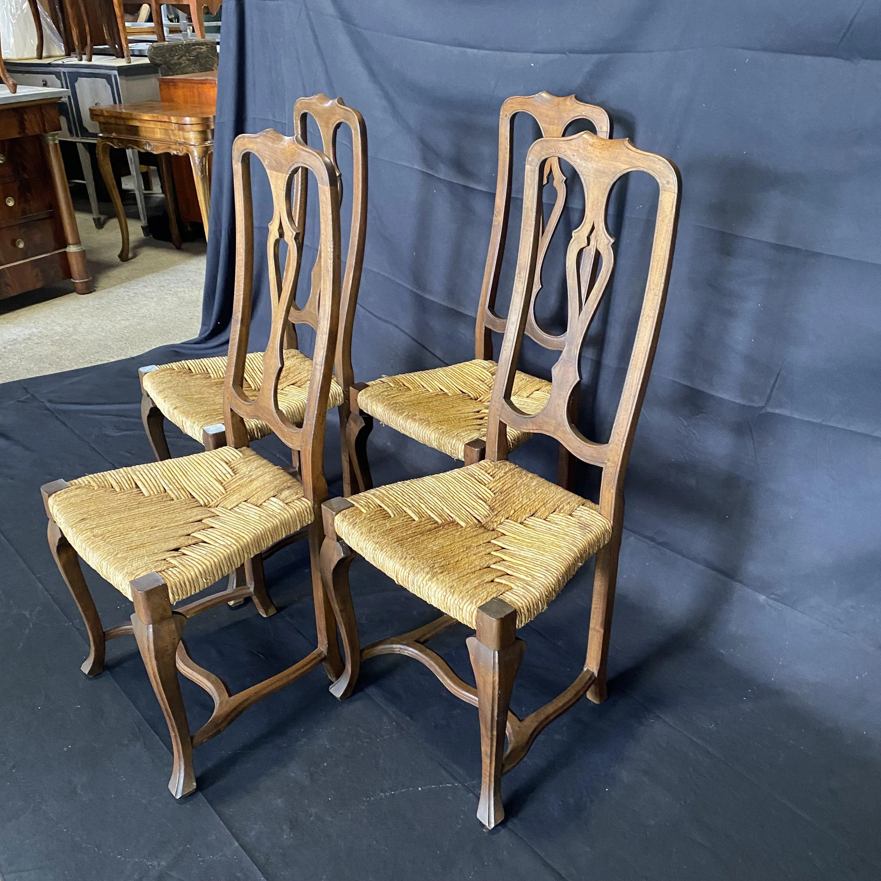 Set of Four 19th Century Country French Provincial Walnut Dining Chairs with Patterned Rush Seats