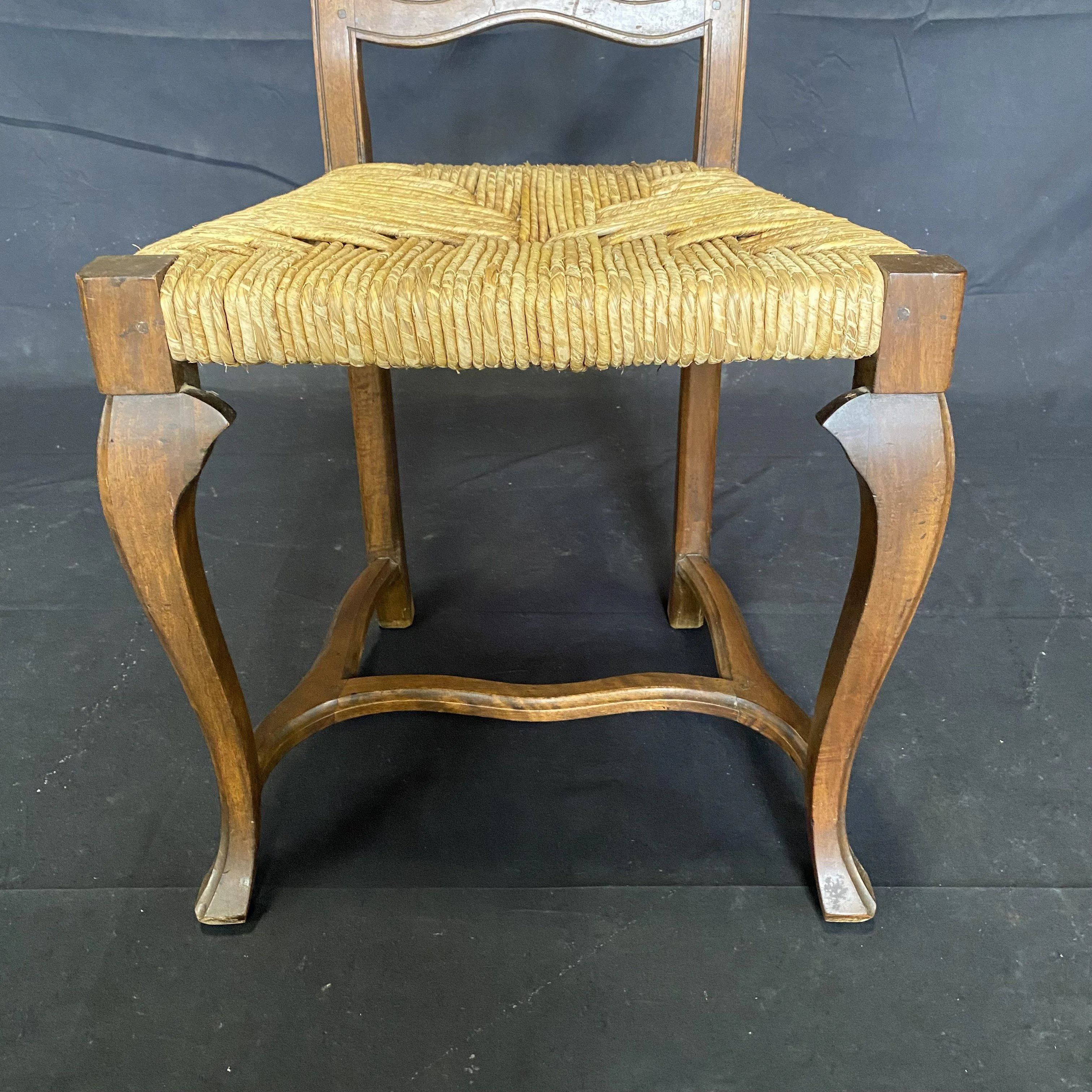 Set of Four 19th Century Country French Provincial Walnut Dining Chairs with Patterned Rush Seats