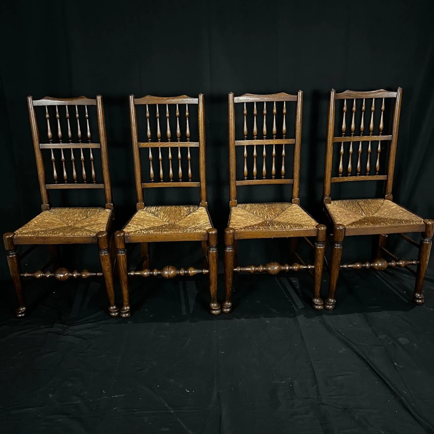 Set of Four Early 19th Century Carved British Oak Dining Chairs or Side Chairs with Original Patina and Rush Seats