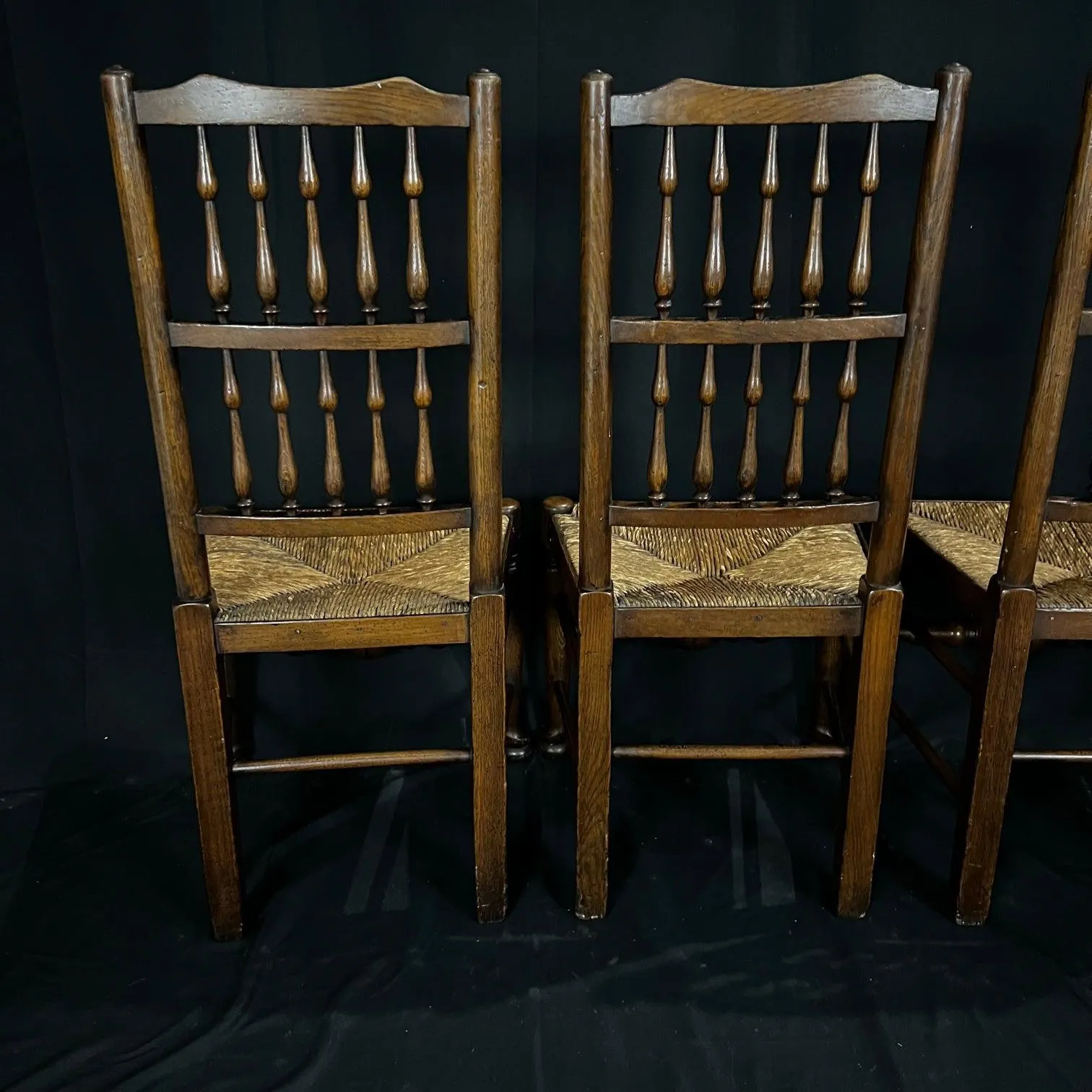 Set of Four Early 19th Century Carved British Oak Dining Chairs or Side Chairs with Original Patina and Rush Seats