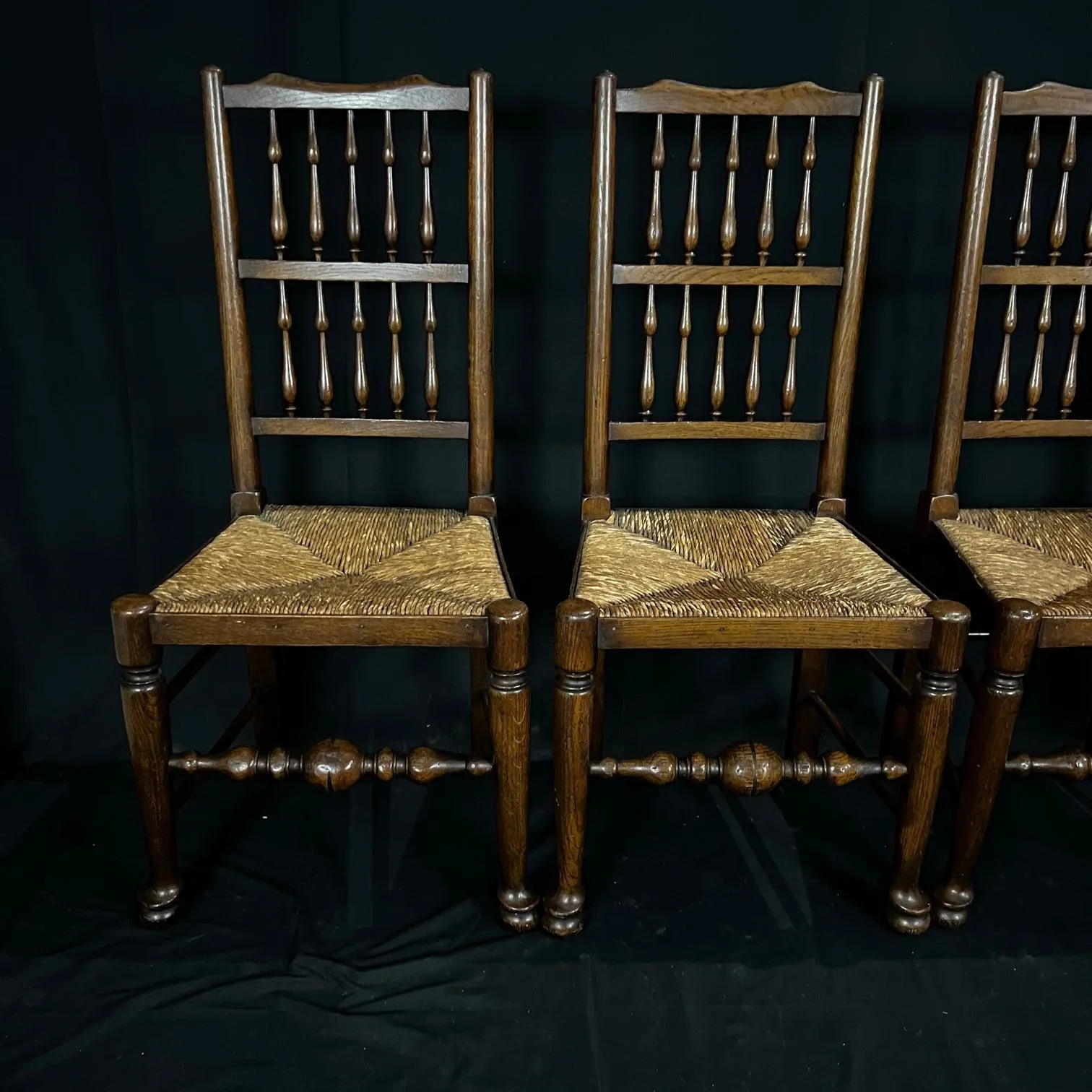 Set of Four Early 19th Century Carved British Oak Dining Chairs or Side Chairs with Original Patina and Rush Seats