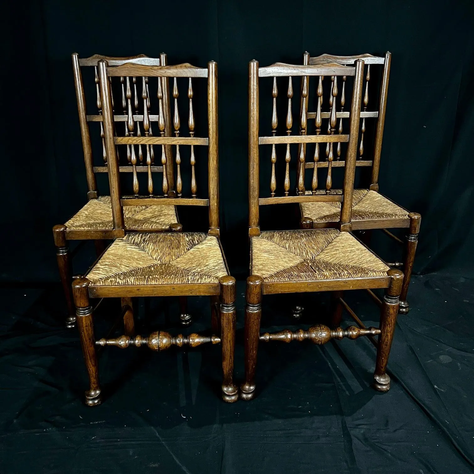 Set of Four Early 19th Century Carved British Oak Dining Chairs or Side Chairs with Original Patina and Rush Seats